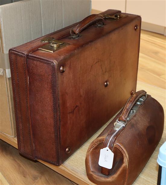 A small Gladstone bag and suitcase